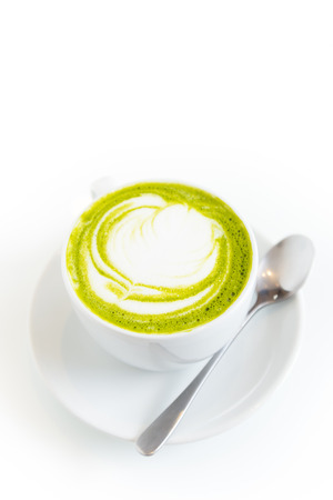 green tea latte art in white cup,isolatedの写真素材