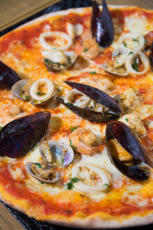thin crust mussels pizzaの写真素材