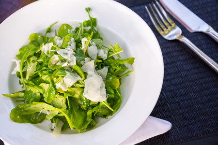 rocket salad sliced cheese closeupの写真素材