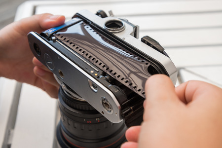 demonstrate how to load film to cameraの写真素材