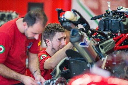 BURIRAM - MARCH 20 : MV Agusta Reparto Corse mechanic inspecting race bike in pit at Chang...