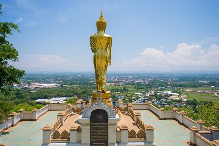 NAN  THAILAND APRIL 27 : golden standing buddha statue over the city at Wat Phra That Khao Noi Nan province Thailand on April 27 2015のeditorial素材