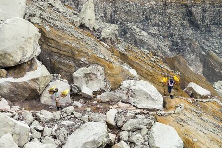 JAVA - INDONESIA, April 21 : worker carry sulfur for selling at Kawah Ijen volcano crater ,Java Indonesia, April 21,2015のeditorial素材