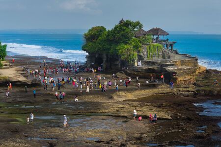 BALI - INDONESIA, April 19 : Tourists walking around Tanah Lot temple during low tide at Bali Indonesia, April 19,2015のeditorial素材