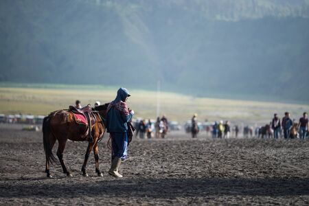 JAVA - INDONESIA, April 22 : tourist riding horse walking up to Bromo volcano crater ,Java Indonesia, April 22,2015のeditorial素材