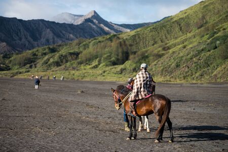JAVA - INDONESIA, April 22 : tourist riding horse walking up to Bromo volcano crater ,Java Indonesia, April 22,2015のeditorial素材
