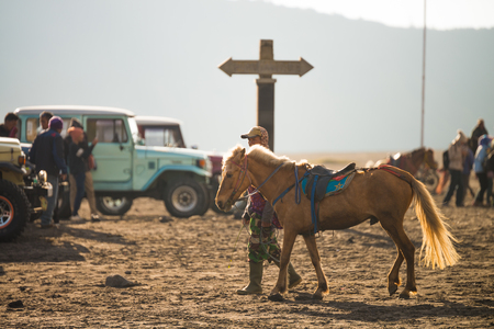 JAVA - INDONESIA, April 22 : tourist riding horse walking up to Bromo volcano crater ,Java Indonesia, April 22,2015のeditorial素材