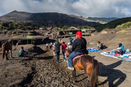 JAVA - INDONESIA, April 22 : tourist riding horse walking up to Bromo volcano crater ,Java Indonesia, April 22,2015のeditorial素材