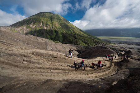 JAVA - INDONESIA, April 22 : tourist riding horse walking up to Bromo volcano crater ,Java Indonesia, April 22,2015のeditorial素材