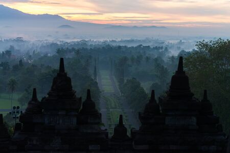 morning blue twilight stone stupa of Borobudur, Indonesia