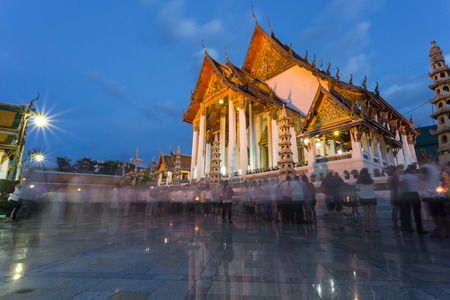 BANGKOK - THAILAND, June 01 : Motion blurred of people walking in the temple due to Buddhist related festival in Bangkok,Thailand on June 1,2015のeditorial素材