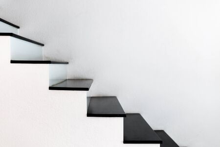 white wall stairs black wooden stepの写真素材