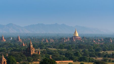 Golden pagoda among pagoda field in Bagan, Myanmarの写真素材