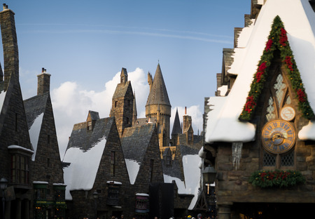 Hogwarts castle behind Hogsmeade village from Harry Potter movies in Universal Studios Japanのeditorial素材