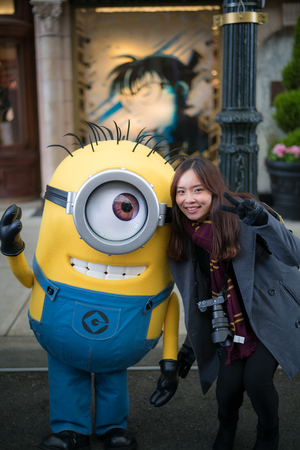OSAKA, JAPAN - January 14,2017 : Young woman tourist taking photo with Stuart the character mascot from Minions moviesのeditorial素材