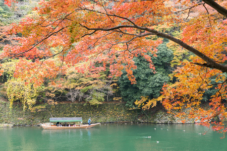 sightseeing tourists boat in Hozu river in autumn season Arashiyama Kyoto, Japanのeditorial素材