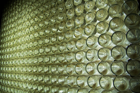 The bottom of bottles with champagne leaving in prospectの写真素材