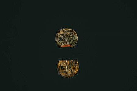 Coin bitcoin with reflection in the mirror
