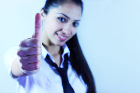 girl on a white background makes a thumbs upのeditorial素材