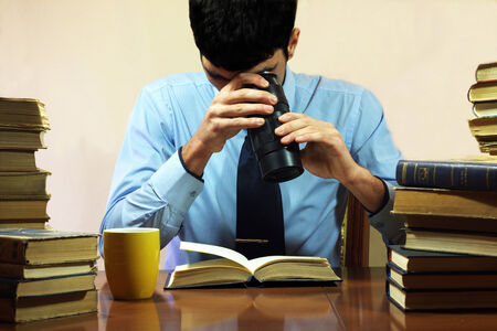 man reading a bookのeditorial素材