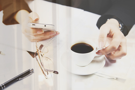 business woman hand phone and coffeeの写真素材