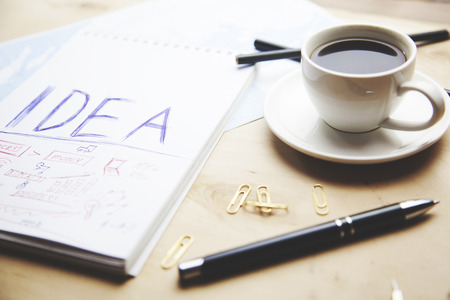paper with coffee and notes on desk