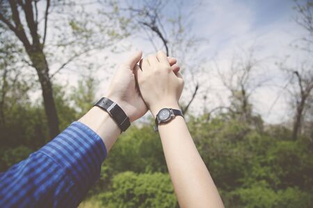 woman and man hands  in the parkの写真素材