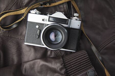 photo camera on the leather  backgroundの写真素材