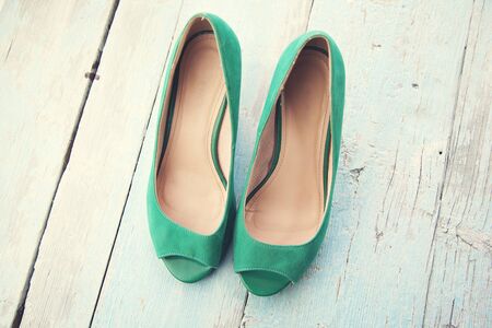 woman green shoes on blue backgroundの写真素材