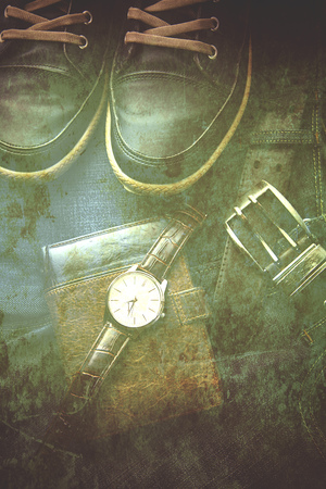 shoes.watch,wallet and jeans on tableの写真素材