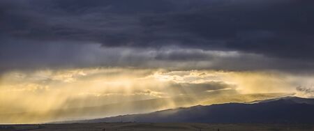 sky clouds at sunset and mountの写真素材