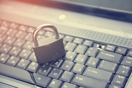 Lock on the laptop keyboard background