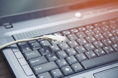 cord and notebook on the wooden tableの写真素材
