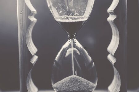 sand clock white and black backgroundの写真素材