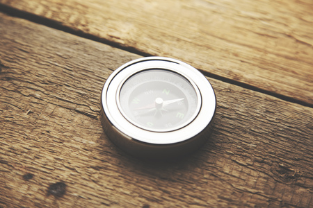 compass on woodの写真素材