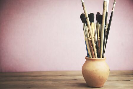 painting brushes on  the wooden tableの写真素材