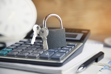 local on calculator and pen on notebookの写真素材