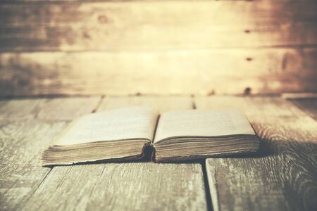 Bunch of vintage books on wooden tableの写真素材