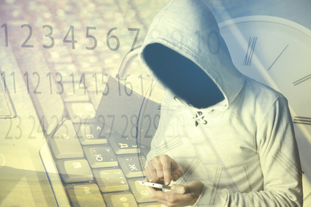 hacker hand phone on  keyboard background