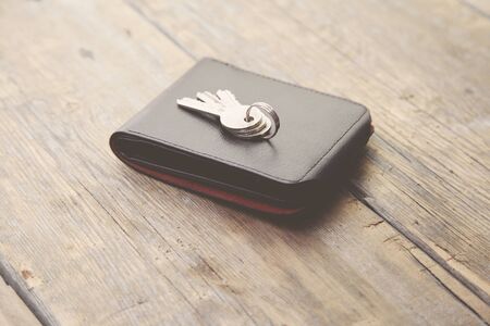 key on wallet on wood backgroundの写真素材