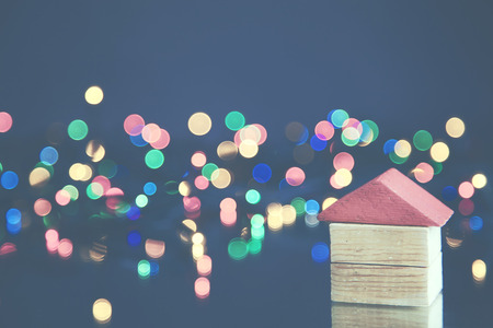 A small wooden house on bokeh backgroundの写真素材