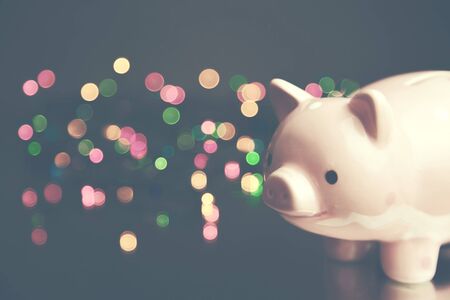 piggy bank on  bokeh light in city nightの写真素材