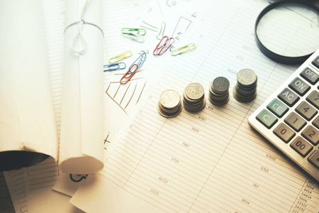 calculator,money,papers  on wooden tableの写真素材