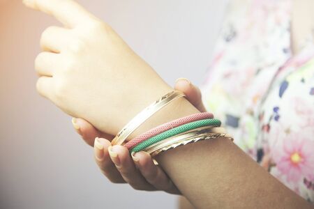 Colorful fashion bracelets on woman handの写真素材