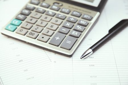 calculator and stationery items on the table