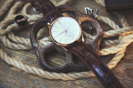 elegant  watch on a textured vintage backgroundの写真素材