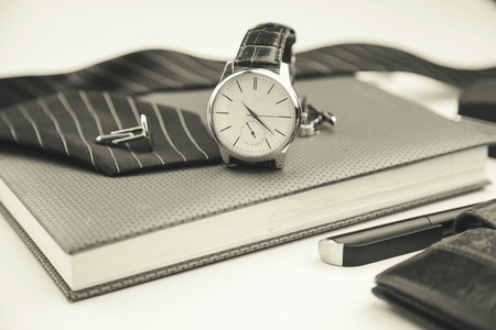 Business accessories on desktop: notebook, diary, fountain pen, cufflinks and watchの写真素材