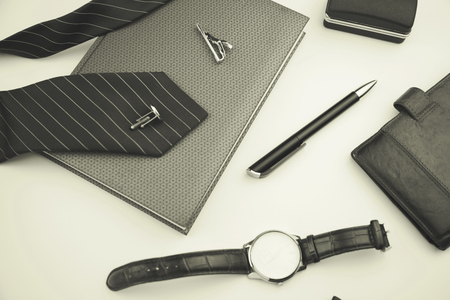 Business accessories on desktop: notebook, diary, fountain pen, cufflinks and watchの写真素材