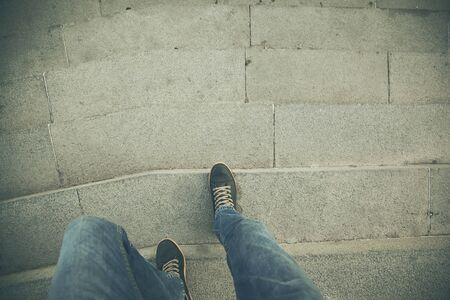 man walking down stair.