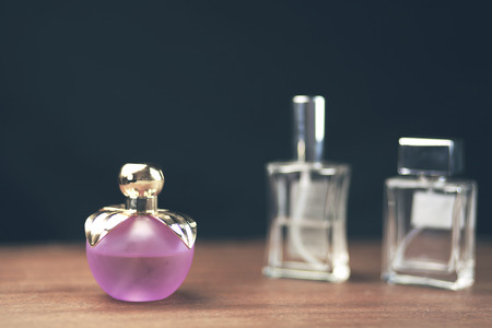 perfume bottles on black background